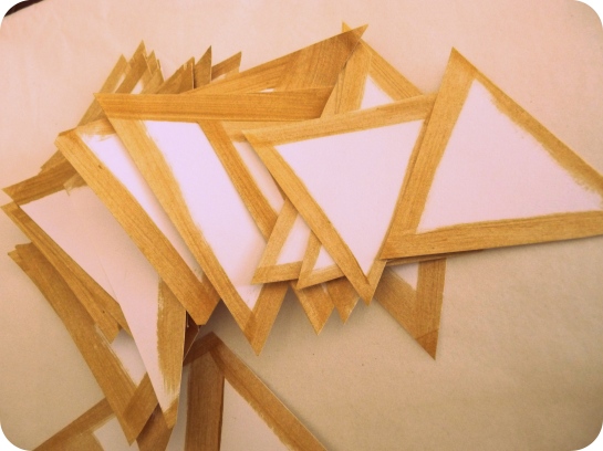 Gold triangle garland - pile of triangles